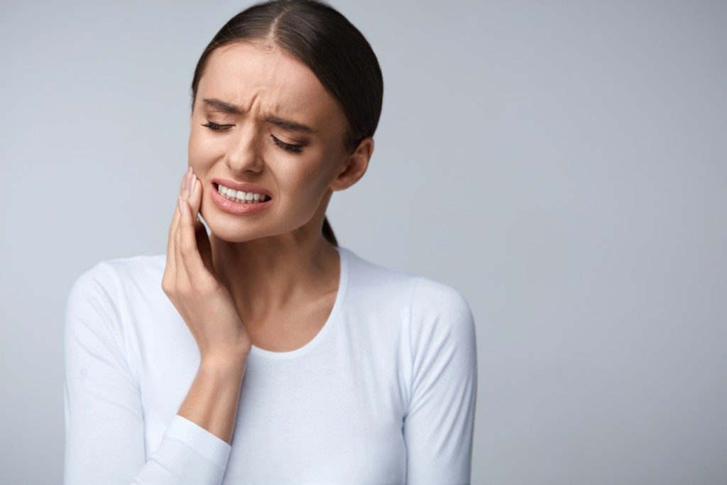 woman suffering from tooth ache