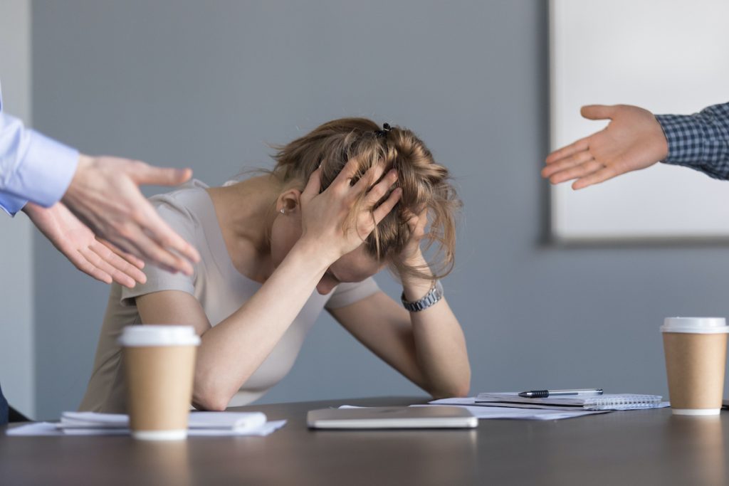 woman feeling stressed at work