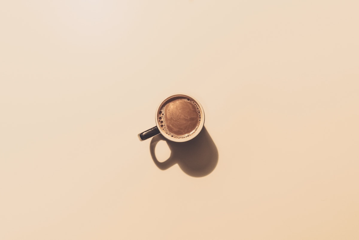 cup of coffee on beige background