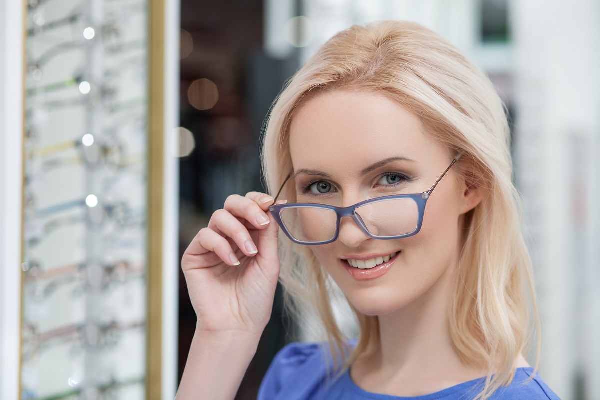 woman trying on glasses