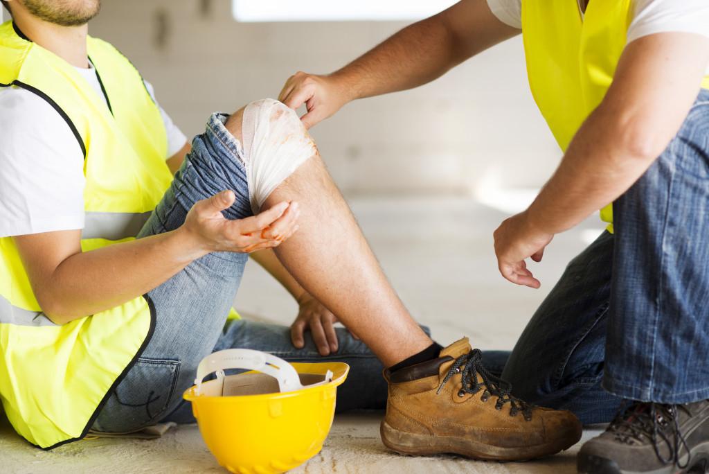 Construction worker with a knee injury while at work.