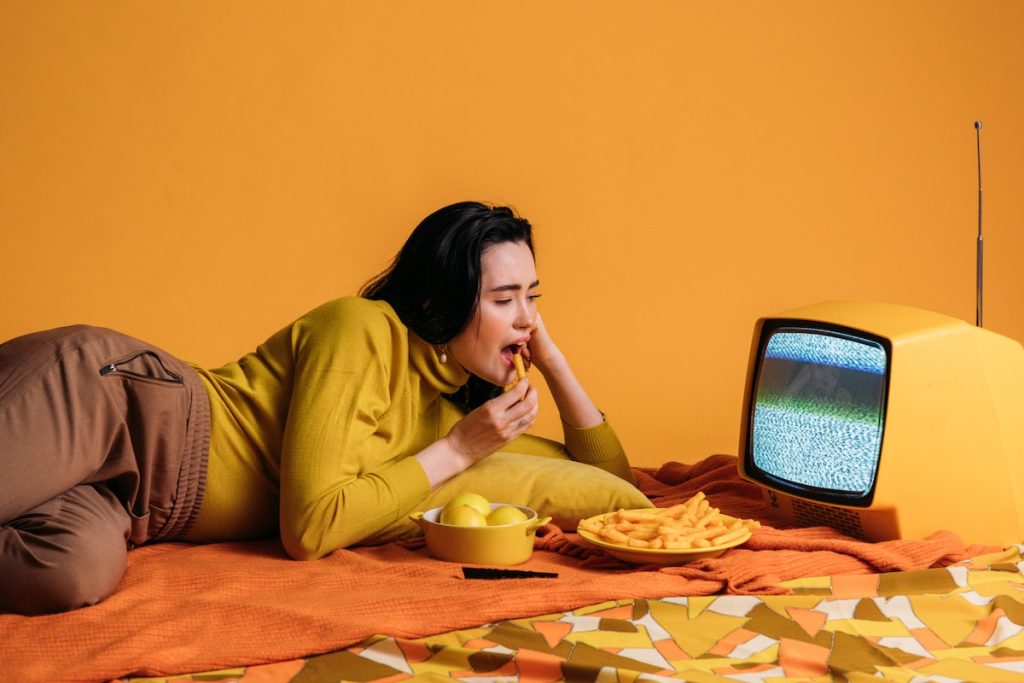 a woman eating her foods