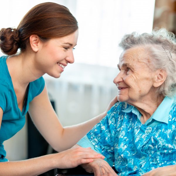 A caregiver with an elderly woman